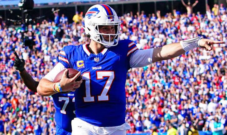 Josh Allen celebra una anotación para los Bills, que le quitaron el invicto a los Dolphins.