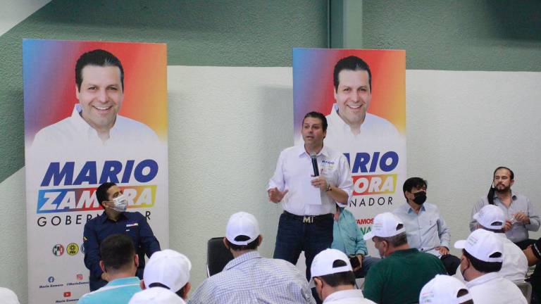 El abanderado del PRI, PAN y PRD, Mario Zamora.