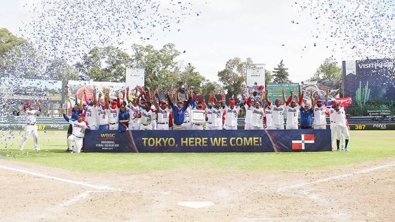 Los dominicanos festejan su pase olímpico.