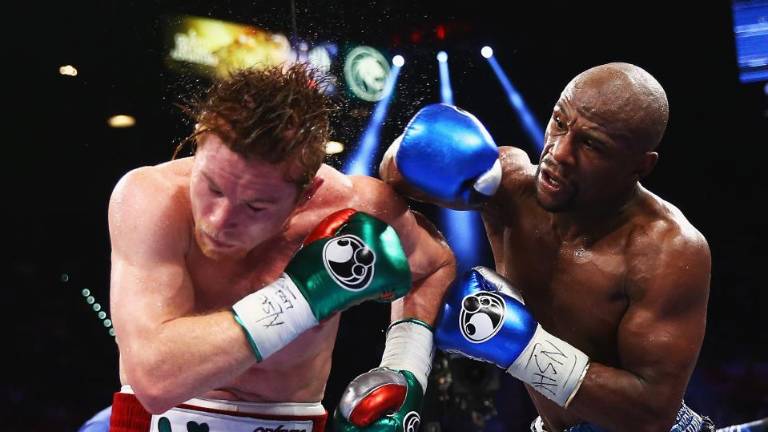 Canelo Alvarez y Floyd Mayweather Jr.