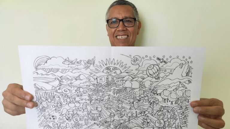Ito Contreras con la ilustración completa, previo a ponerle color.