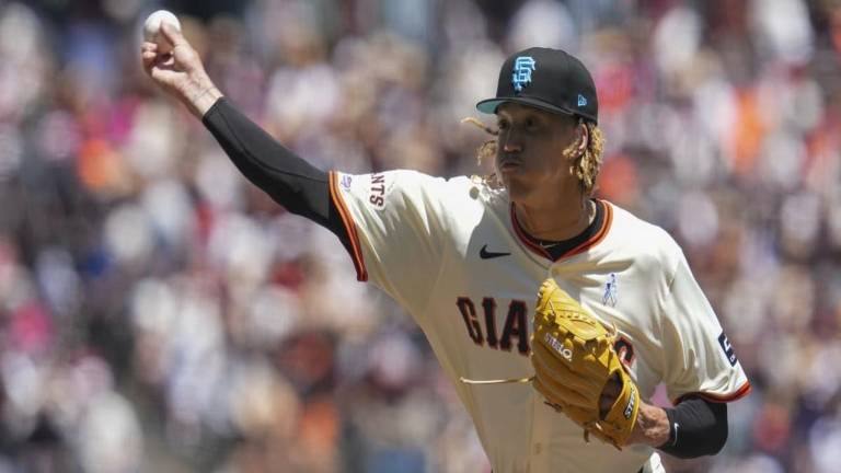 El relevista Spencer Bivens se llevó el triunfo por los Gigantes.